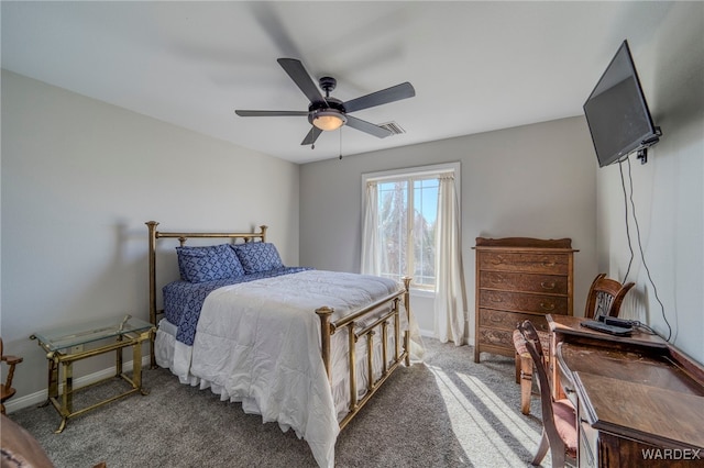 bedroom featuring a ceiling fan, baseboards, and carpet flooring