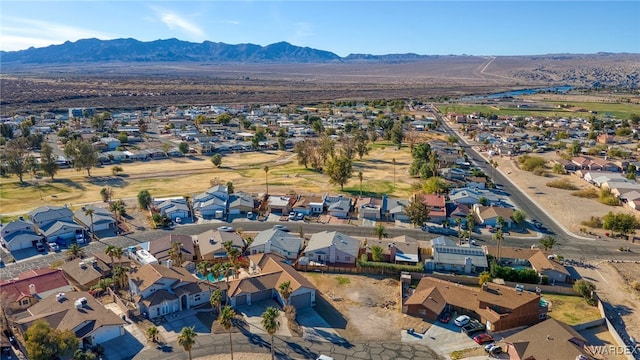 drone / aerial view featuring a residential view and a mountain view