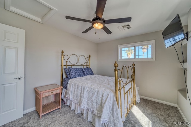 bedroom with visible vents, attic access, a ceiling fan, light carpet, and baseboards