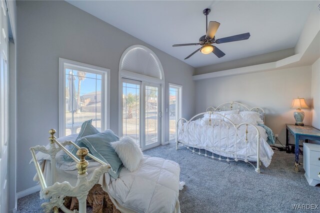 carpeted bedroom with access to exterior and a ceiling fan