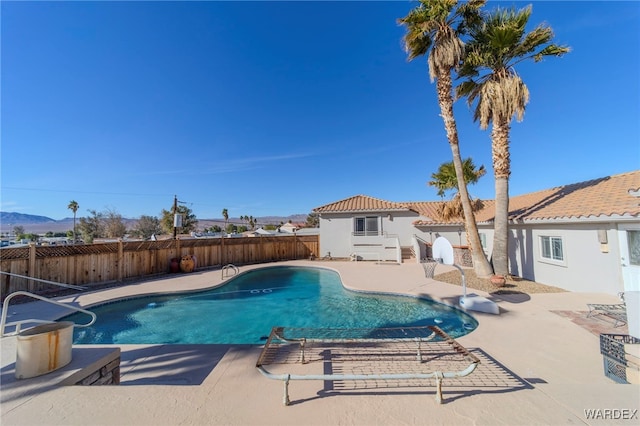 view of pool featuring a fenced in pool, a patio area, and a fenced backyard