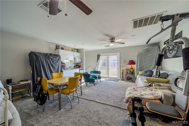 interior space featuring visible vents and a ceiling fan