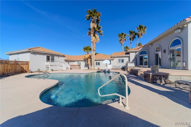 view of swimming pool with a fenced in pool, a patio area, and fence