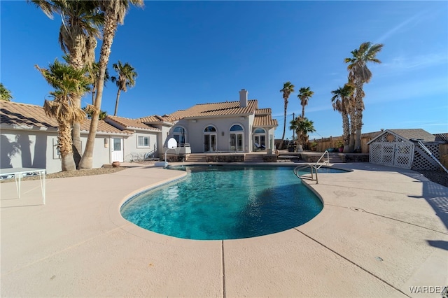 view of pool featuring a patio, fence, and a fenced in pool