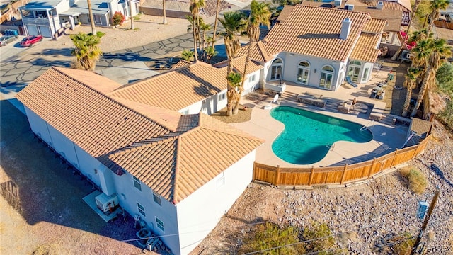 pool featuring a patio and a fenced backyard