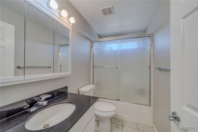 bathroom with marble finish floor, shower / bath combination with glass door, visible vents, toilet, and vanity