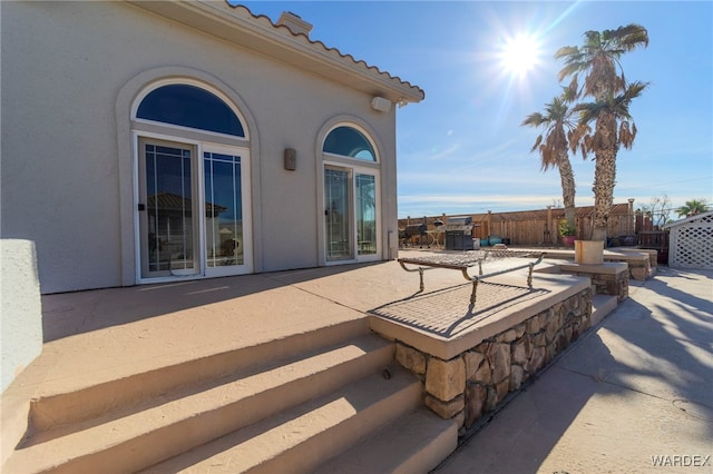 view of patio / terrace featuring fence