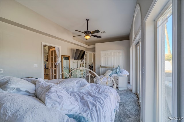 carpeted bedroom with a ceiling fan