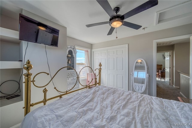 carpeted bedroom with baseboards, visible vents, a ceiling fan, and a closet