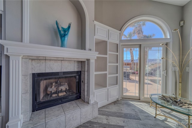 interior space with a fireplace and light wood-style flooring