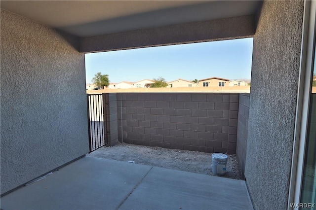 view of patio featuring fence