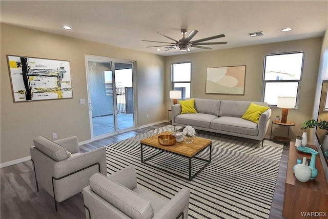 living area with baseboards, visible vents, ceiling fan, wood finished floors, and recessed lighting