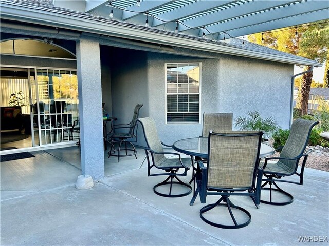 view of patio with a pergola and outdoor dining space