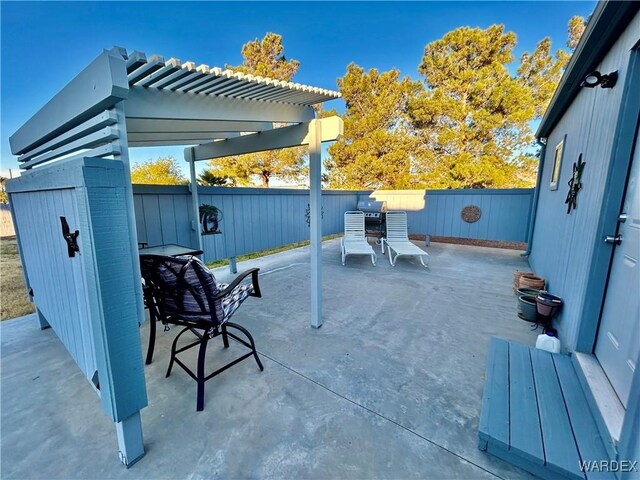 view of patio / terrace featuring a fenced backyard, a pergola, and outdoor dining space