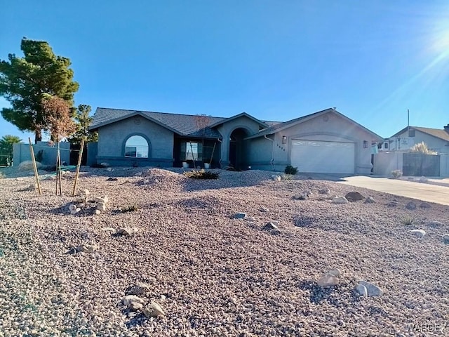 single story home featuring driveway and an attached garage