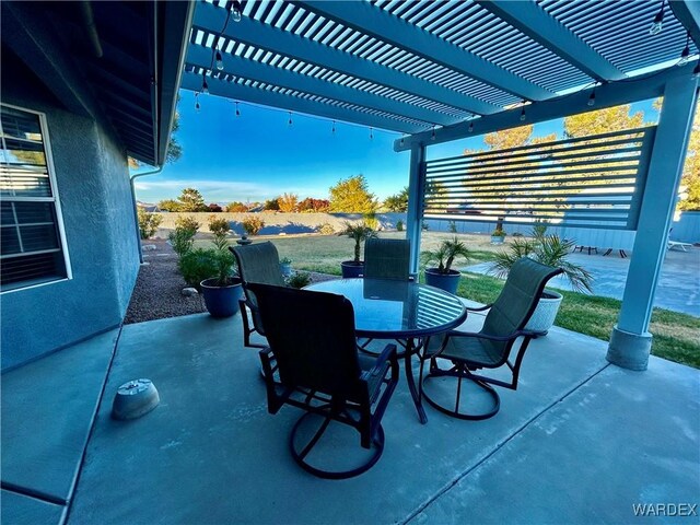 view of patio featuring outdoor dining space and a pergola