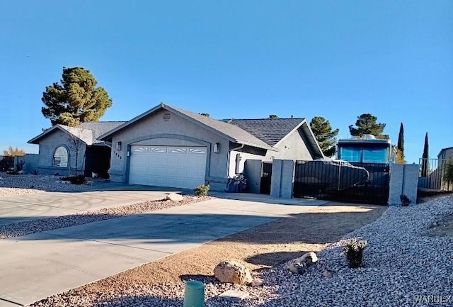 ranch-style house with a garage, driveway, fence, and stucco siding