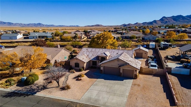 drone / aerial view featuring a mountain view and a residential view