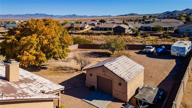 drone / aerial view featuring a residential view and a mountain view