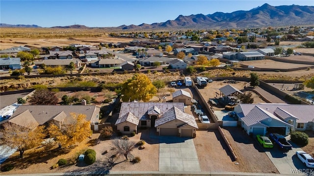 drone / aerial view with a residential view and a mountain view