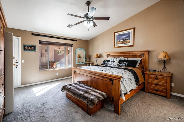 bedroom with visible vents, vaulted ceiling, light carpet, and baseboards