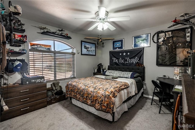 bedroom with a ceiling fan and light colored carpet