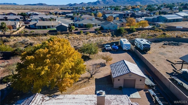 drone / aerial view with a residential view and a mountain view