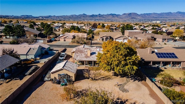 drone / aerial view featuring a residential view and a mountain view