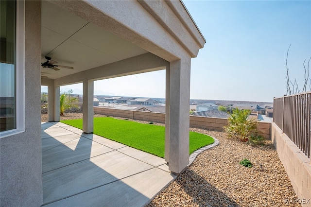 view of patio with a fenced backyard and a ceiling fan