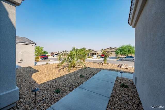 view of yard featuring a residential view