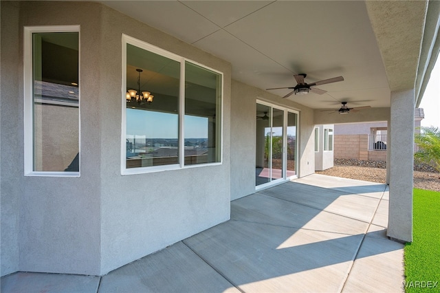 view of patio with ceiling fan and fence