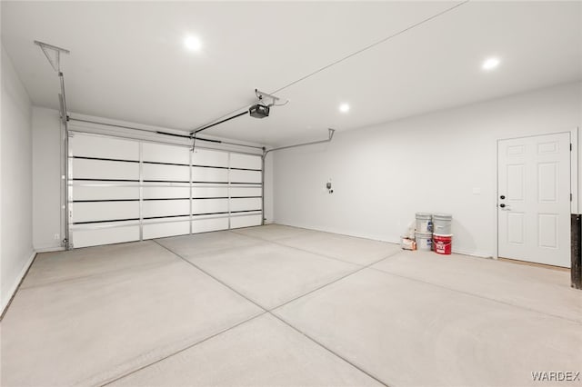 garage featuring baseboards and a garage door opener