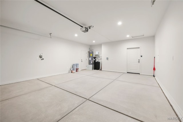 garage with baseboards, water heater, recessed lighting, and a garage door opener