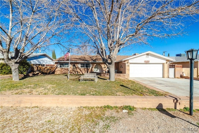 ranch-style home with concrete driveway, a front lawn, an attached garage, and brick siding