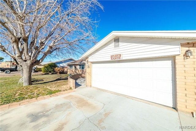 garage featuring driveway