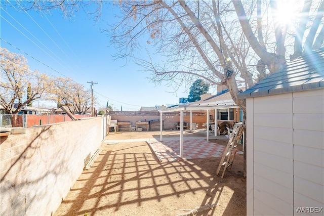 view of yard with a fenced backyard and a patio