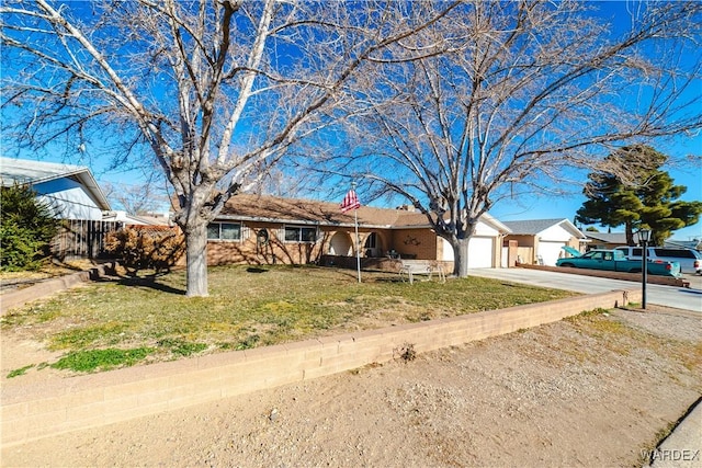 single story home featuring driveway, an attached garage, fence, and a front yard