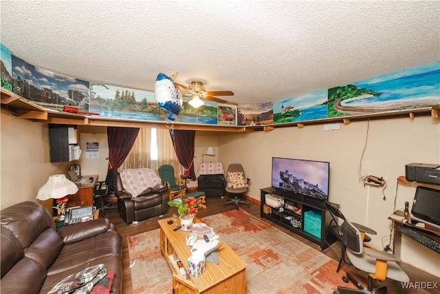 living room featuring a textured ceiling, a ceiling fan, and wood finished floors