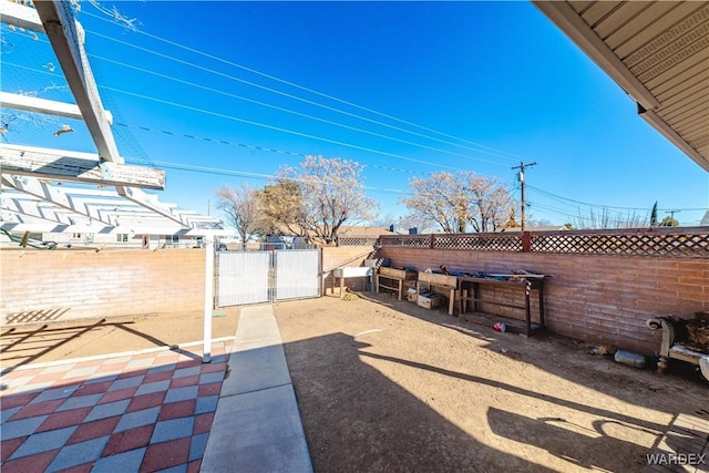 view of patio / terrace with a gate and fence