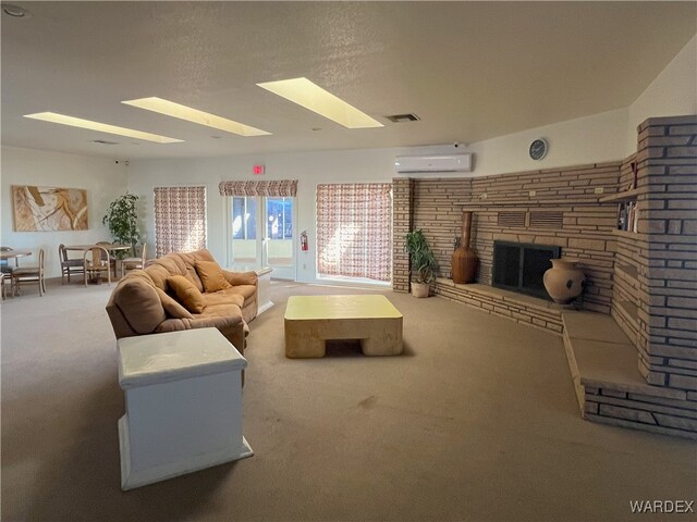 carpeted living area featuring a wall mounted AC, a fireplace, and visible vents