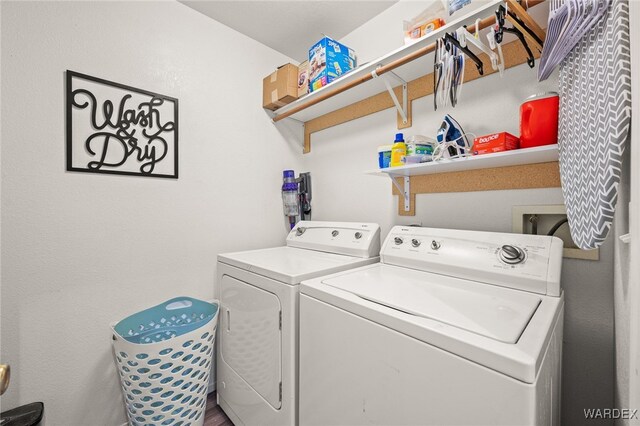 clothes washing area featuring laundry area and independent washer and dryer