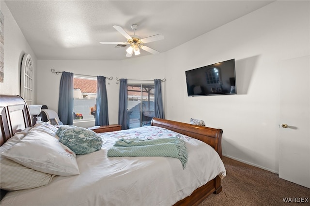 bedroom featuring visible vents, a ceiling fan, carpet, access to outside, and a textured ceiling