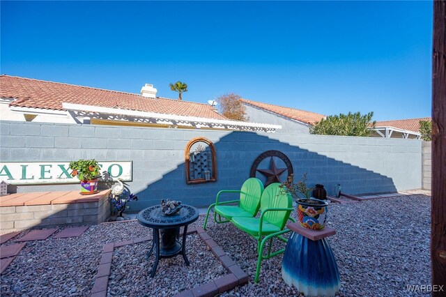 view of patio featuring fence