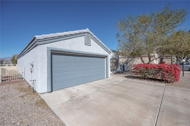 garage with fence