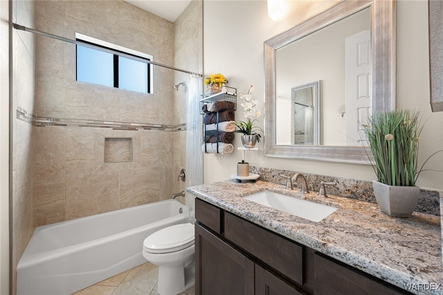 bathroom with toilet, tile patterned floors, vanity, and bathing tub / shower combination