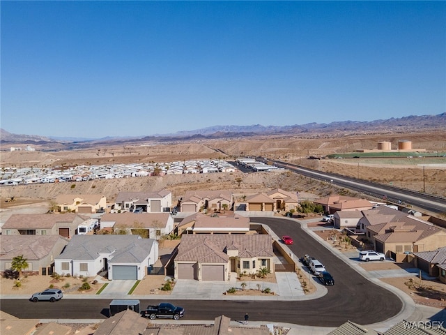 aerial view featuring a mountain view and a residential view