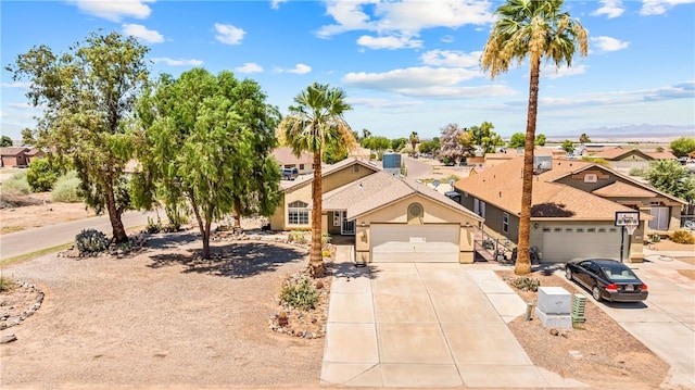1951 E Oatman Pl, Mohave Valley, AZ 86440 - view of front facade with concrete driveway, a residential view, and a garage