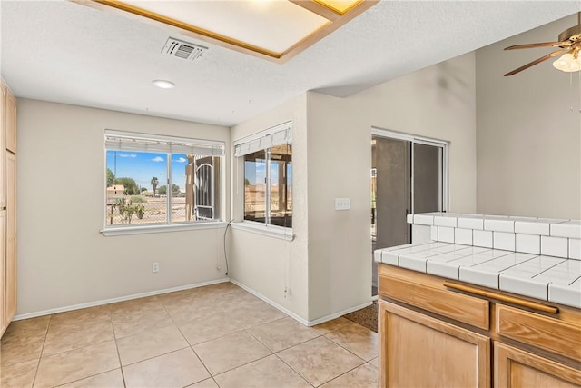 1951 E Oatman Pl, Mohave Valley, AZ 86440 - unfurnished dining area featuring ceiling fan, light tile patterned flooring, a textured ceiling, and recessed lighting