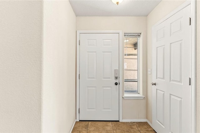 1951 E Oatman Pl, Mohave Valley, AZ 86440 - doorway with baseboards and light tile patterned floors