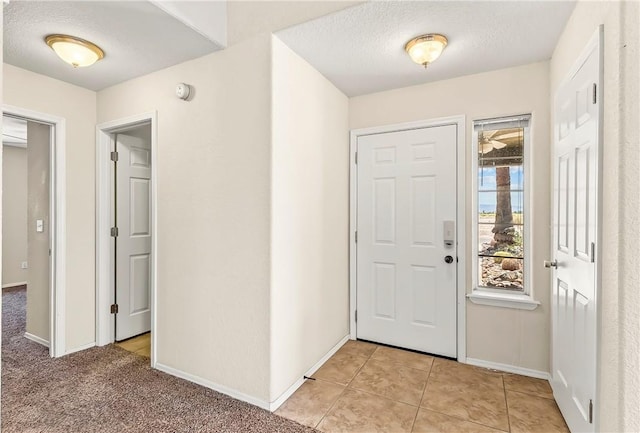 1951 E Oatman Pl, Mohave Valley, AZ 86440 - entrance foyer featuring light tile patterned flooring and a textured ceiling